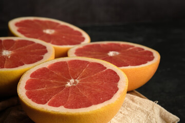 Fototapeta na wymiar sliced ripe grapefruit on a light cloth