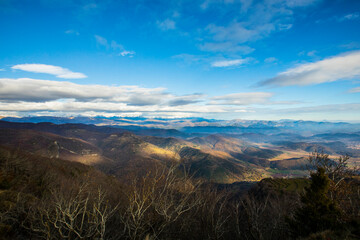 Young hiker enjoying in Puigsacalm peak, La Garrotxa, Spain