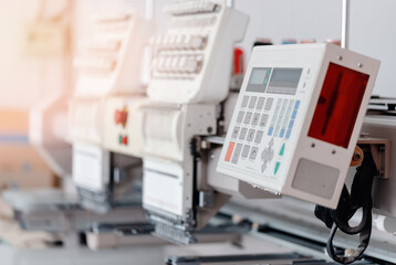Closeup sewing machine with thread, background white color sun light. Concept Interior of garment factory