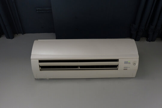 front view white wall mounted air conditioner on white and grey wall background, object, technology, decor, fashion, home, office, copy space