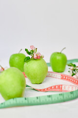 Green apples with  measuring tape, Healthy Lifestyle Concept, Diet Health food on white background