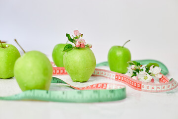 Green apples with  measuring tape, Healthy Lifestyle Concept, Diet Health food on white background