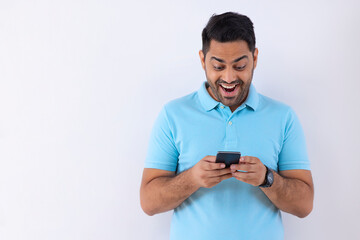 Portrait of a young man using Smartphone against white background