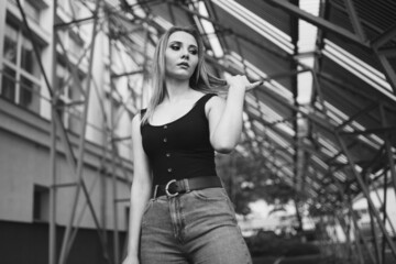 Portrait of a girl, serious facial expression, outdoors girl, street lifestyle.