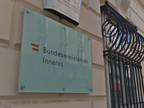 View of information sign on the wall of the building of Bundesministerium für Inneres (BMI, Ministry of the Interior) in the historic center of Vienna.