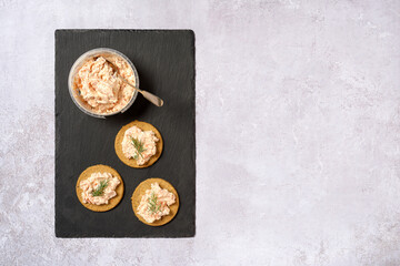 Trout pate on oatcakes with spoon