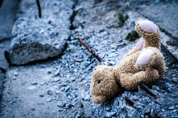 Conceptual image: Russia's war against Ukraine.  Broken toys. Copy space. Horizontal image.