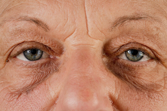 Close up, macro photo of a senior female color eyes, iris, pupil, eye lashes, eye lids.