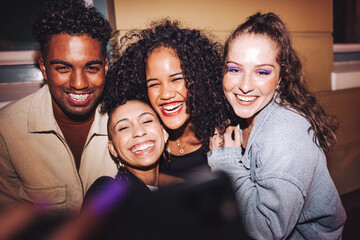 Taking happy selfies on friends night out