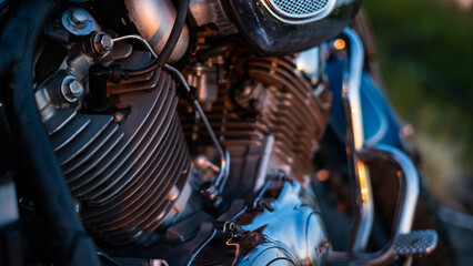 Close-up of chrome parts of a motorcycle outdoors