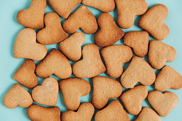 Homemade heart shaped cookies for Valentines day. Top view. Blue background