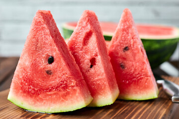 Sliced watermelon on wooden background. Close-up, selective focus