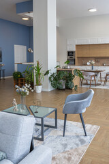 minimalist modern interior design huge bright apartment with an open plan in Scandinavian style in white, blue and dark blue colors with columns in the center. includes kitchen area, office and lounge