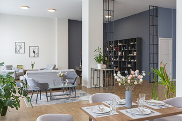 minimalist modern interior design huge bright apartment with an open plan in Scandinavian style in white, blue and dark blue colors with columns in the center. includes kitchen area, office and lounge