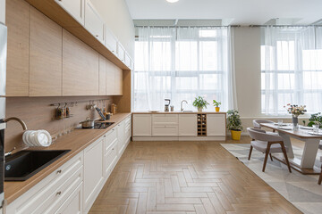 kitchen area in minimalist modern interior design huge bright apartment with an open plan in Scandinavian style in white, blue and dark blue colors