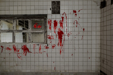 Bloody handprints on a tiled wall and a window
