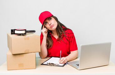young adult pretty woman. company employee with boxes