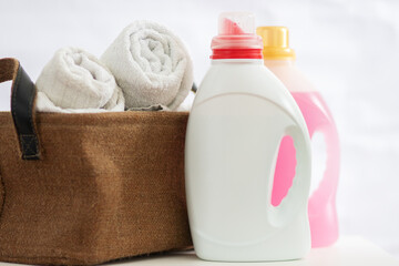 laundry gel liquid powder, laundry conditioner softener and basket with clothes