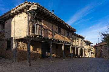 Fototapeta na wymiar View of the traditional houses of the medieval village of Calatañazor in a sunny day, Soria, Castilla y Leon, Spain.