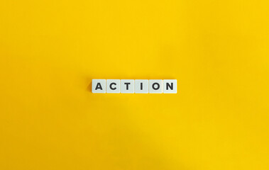 Action Word On Block Letter Tiles on Yellow Background. Minimal Aesthetics.