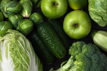 Different green vegetables and fruits close up