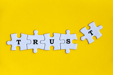 Word trust on missing jigsaw puzzle. trust concept
