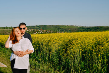 couple hugging on the field