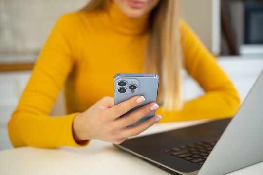 Freelancer girl using mobile phone for communication online. Young woman networking with clients on social media app in smartphone