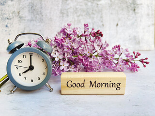 Cup of Coffee , Alarm Clock ,Good Morning Message and Purple Lilac Flowers 