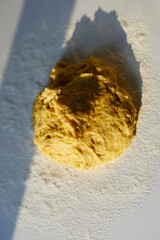 Baking, tasty cookies or pastry making concept. Pie dough or cookie baking in kitchen on white table in sunset sunlight. Top view. High quality vertical photo