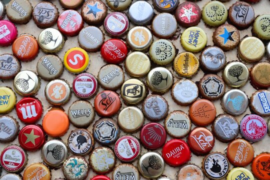 LONDON, UK - JULY 13, 2019: Mixed Beer And Non Alcoholic Beverages Metal Bottle Caps In London UK.