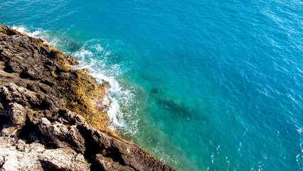 Aerial view of sea hitting the rocks on Porto Katsiki beach. Tropical turquoise sea in summer season on Lefkada island.