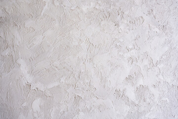artistic plaster on a gray and white wall. Repairs. elements of wall decor. copy space. texture. background.