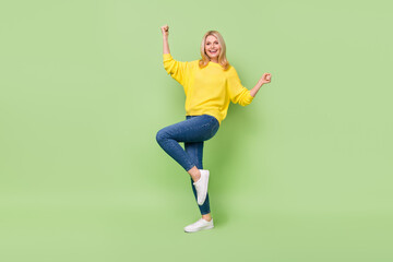 Fototapeta na wymiar Full length photo of delighted aged lady celebrate lucky lottery champion fist up isolated green color background
