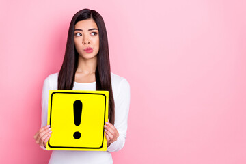 Photo of think young brunette lady hold sign look promo wear white shirt isolated on pink color...