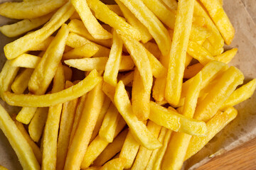 Food background yellow potato french fries from above