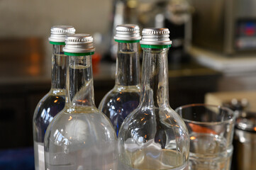 A glass bottle with a metal lid. Bottles with drinks or syrup for cocktails