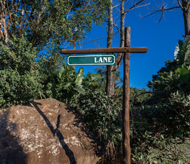 wooden sign post with word lane