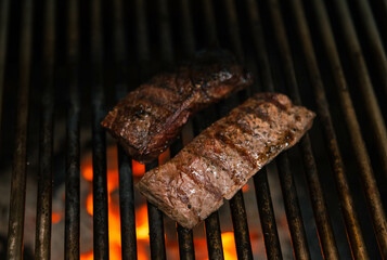 Beef Steak on a charcoal barbecue grill 