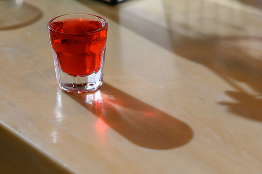 Red Holiday Shot Served In A Clear Glass