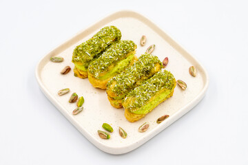 Pistachio eclair cake. Eclair cake with pistachio filling on a white background. close up