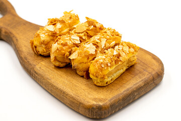 Cream eclairs cake. Eclair cake with cream filling on a white background. close up