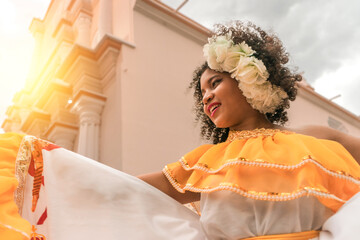 Traditional curly-haired mestizo dancer with a typical Nicaraguan costume dancing outside the cathedral of Leon Nicaragua celebrating the independence festivities of Central America.