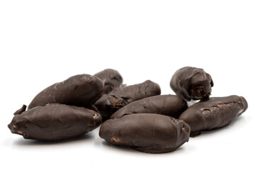 Special chocolate with dark outside and coconut inside. Dark chocolate with coconut filling on a white background. close up