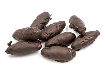 Special chocolate with dark outside and coconut inside. Dark chocolate with coconut filling on a white background. close up