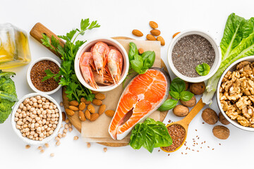 Food sources of omega 3 and omega 6 on white background top view. Foods high in fatty acids...