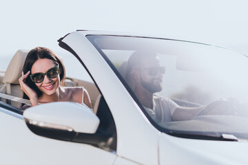 Photo of carefree charming husband wife wear casual clothes riding cabriolet enjoy summer outside...