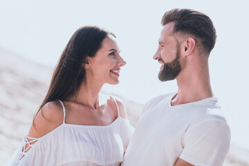 Photo of sweet pretty husband wife wear casual clothes hugging walking smiling outside countryside