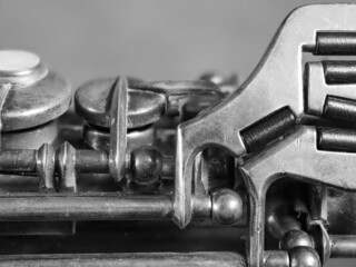 a grayscale shot of a  clarinet on a blurred background