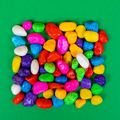 the shape of the square formed with colored pebbles	